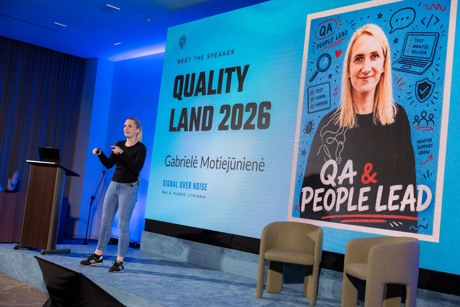 Fail Nights 2026 on stage, with the Meet the Speaker slide for Gabrielė Motiejūnienė on the screen behind.